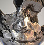 Scultura figurativa viso realizzato da Giuseppe D'Angelo in metallo e tormalina nera