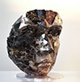 Giuseppe D'Angelo scultura un viso in metallo e marmo nero portoro
