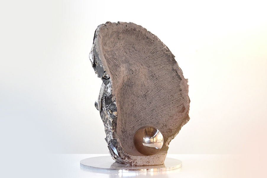 Giuseppe D'Angelo scultura un viso in bronzo e marmo emperador