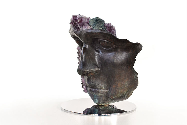 Giuseppe D'Angelo scultura un viso in bronzo e marmo emperador